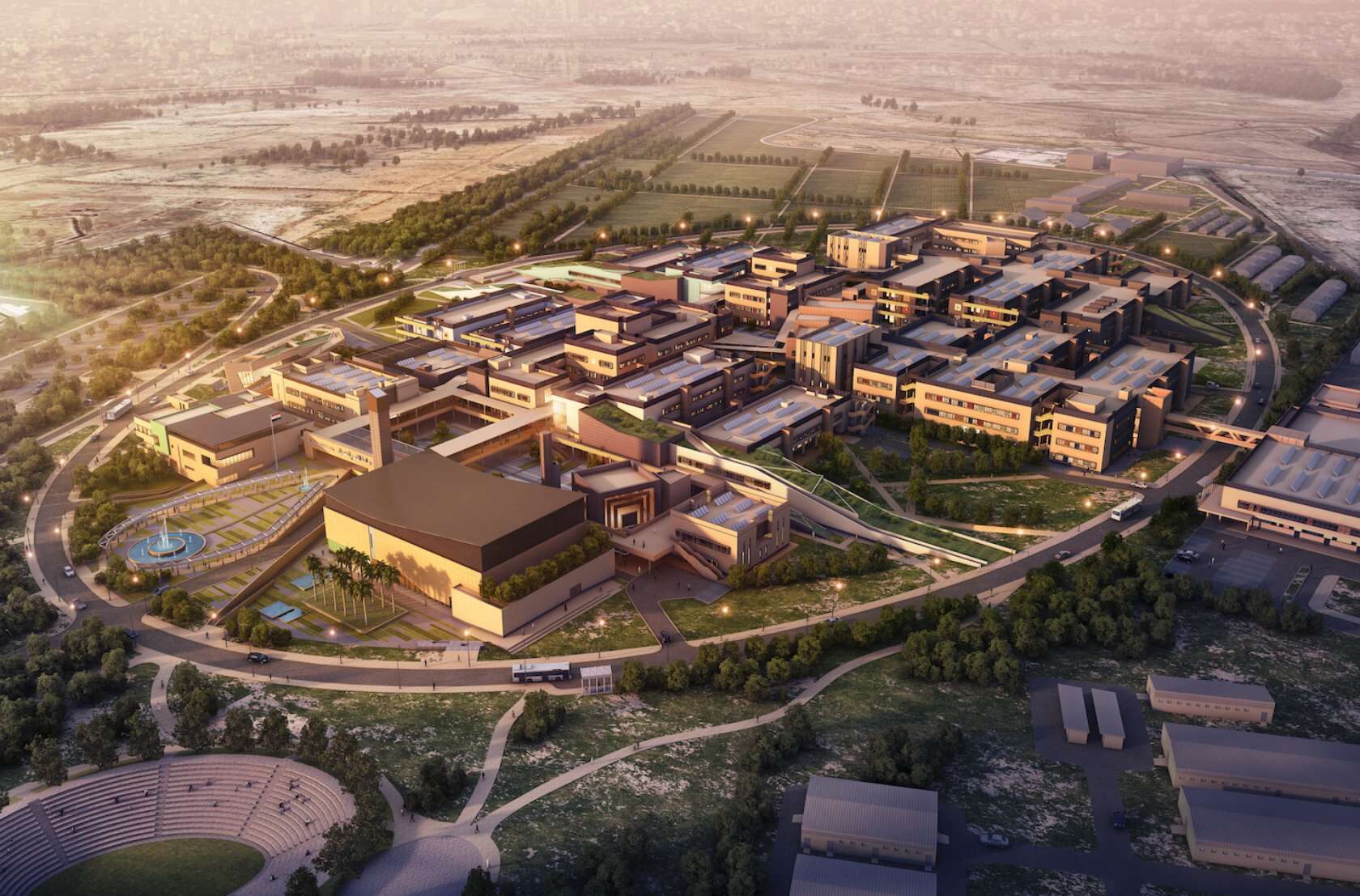 Aerial 3D rendering of a sprawling modern hospital or university campus complex in the UAE, featuring interconnected buildings, extensive landscaping, and road infrastructure at sunset.